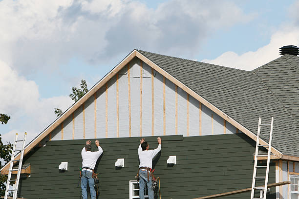 Professional Siding technician working in Malden, MA